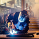A welder welding in factory