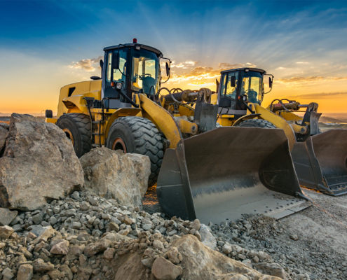 Two excavators removing stone in the construction works of a road
