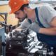 Experienced operator in a hard hat. Metalworking industry